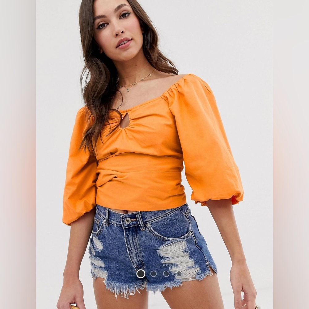 Orange puff sleeve top with tie detail